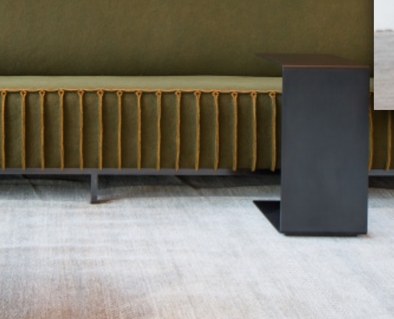Olive pleated banquette detail.